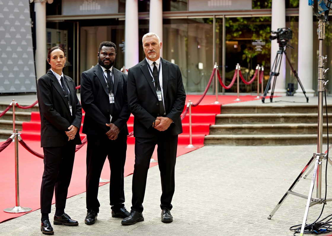 Security team standing on red carpet