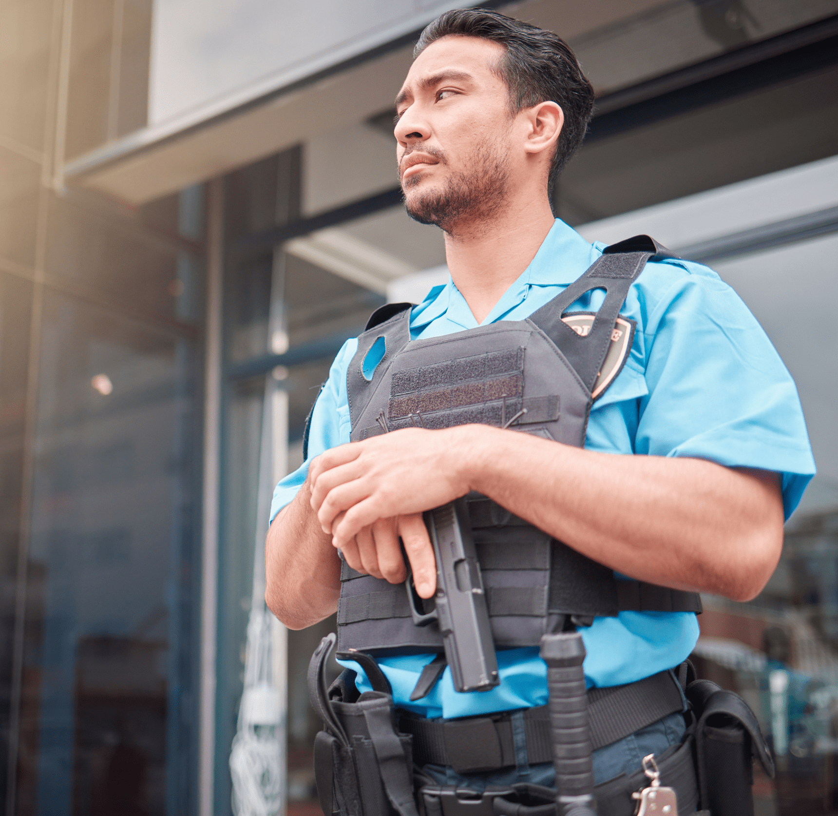 Security guard standing alert outside building