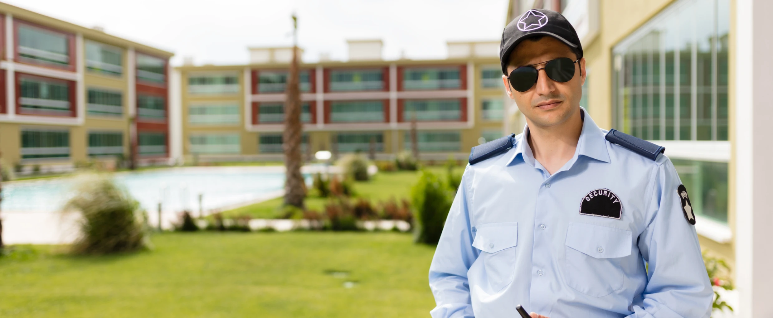 Policeman with sunglasses in outdoor setting